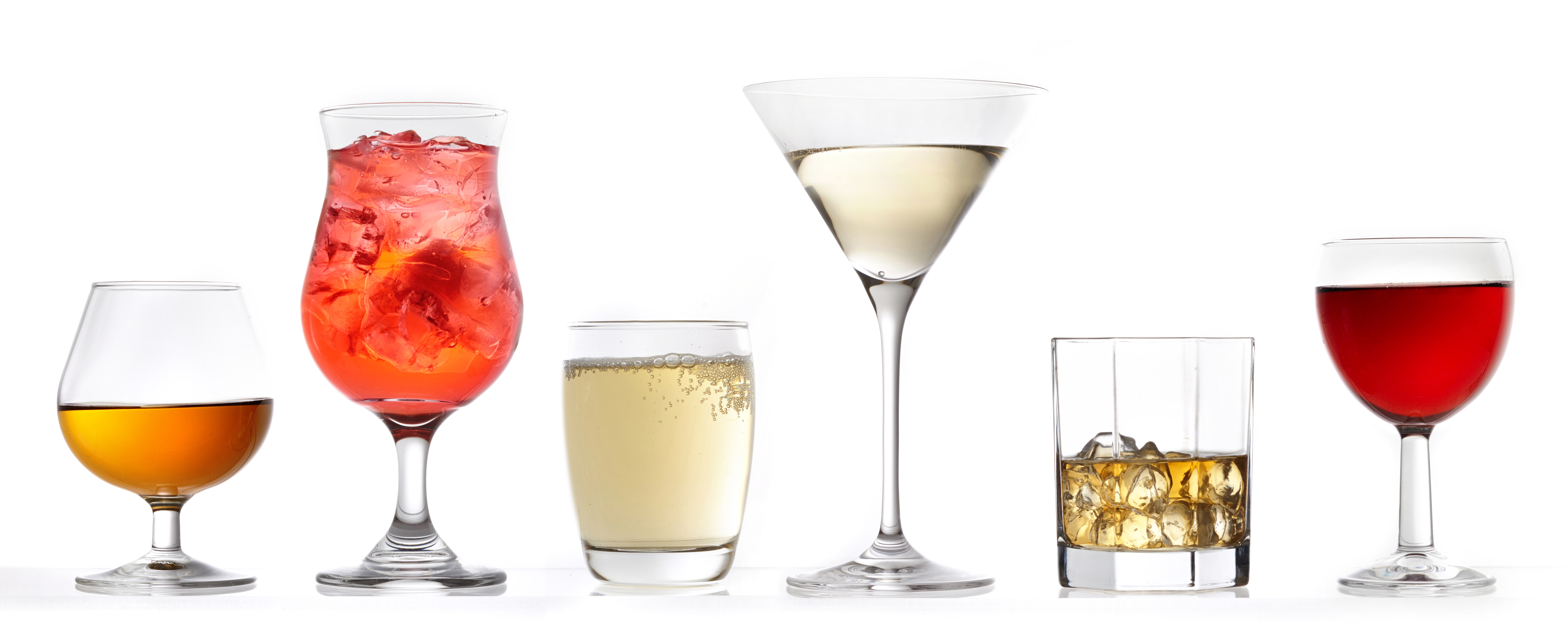 three glasses of various drinks on a white background