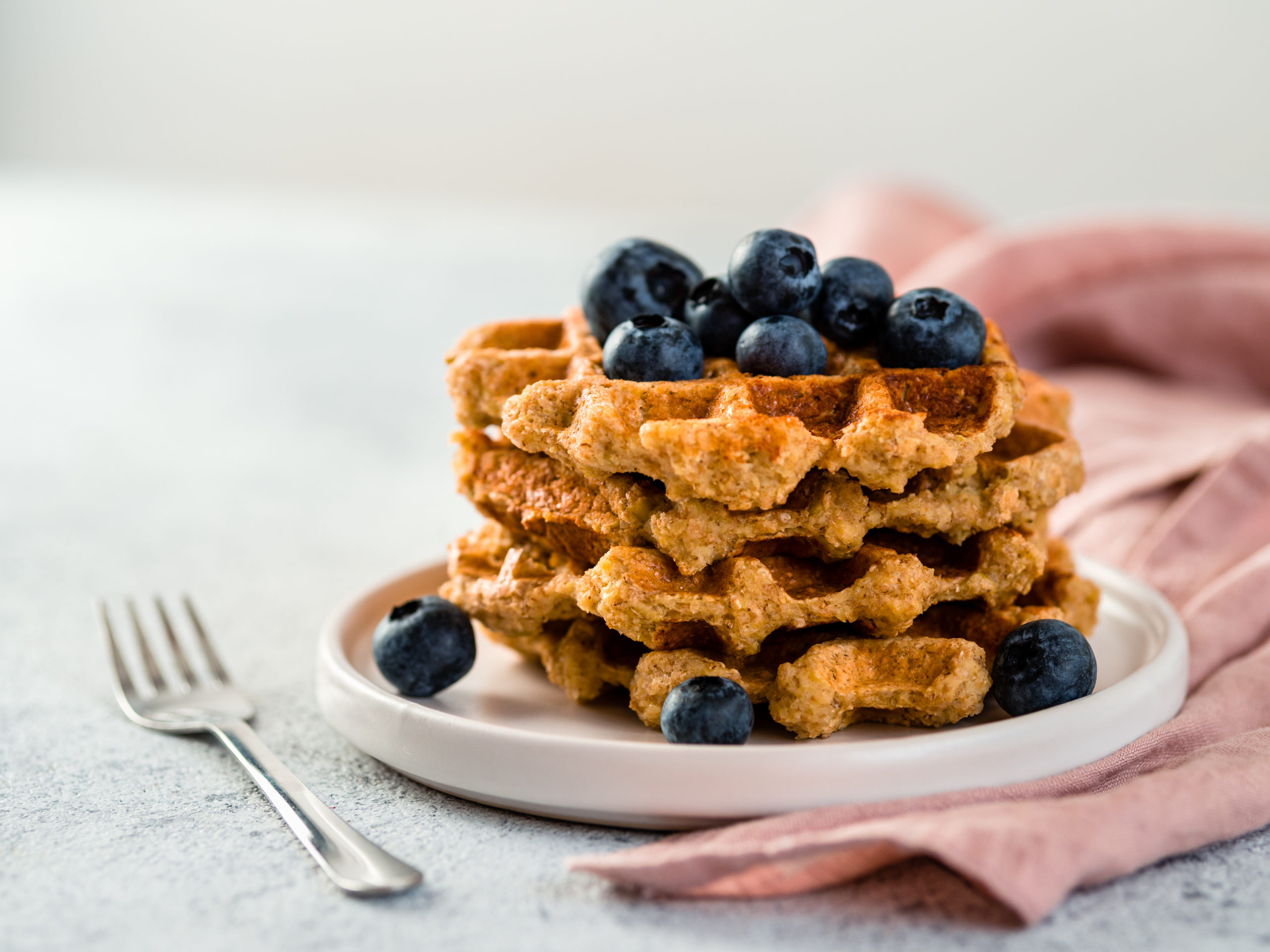 Stack of high fiber vegan waffles made with wheat bran